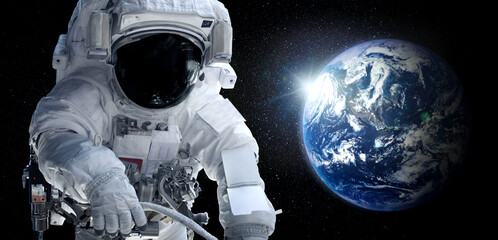 Astronaut spaceman do spacewalk while working for space station in outer space . Astronaut wear...