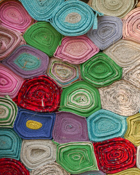 Stack Of Colorful Rolls Of Carpets At Ancient Shahi Eid Gah Mosque In Multan, Punjab, Pakistan	
