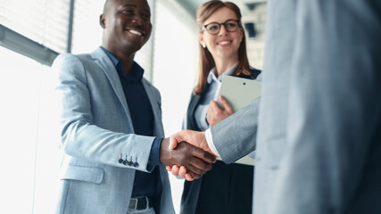 Business people shaking hands, finishing up a meeting.