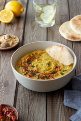 Hummus with seasonings and pita. Healthy eating. Vegetarian food. Diet.