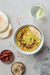 Hummus with seasonings and pita. Healthy eating. Vegetarian food. Diet.