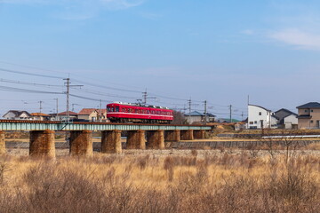 Fototapeta na wymiar Train running on a railway bridge over the river , Takamatsu city, Kagawa, Shikoku, Japan