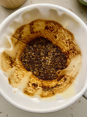 Finished Brew and Coffee Dripper Bed with Filter Paper.