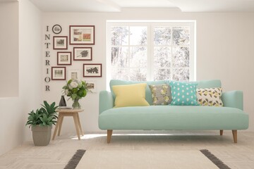 White living room with sofa and winter landscape in window. Scandinavian interior design. 3D illustration
