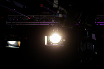 Professional lighting equipment in the studio of a news broadcaster during a live transmission.