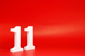 Eleven ( 11 ) white number wooden on Red Background with Copy Space - New promotion 11% Percentage ...