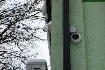 Camera secure system on the building wall
