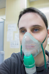 young boy with oxygen mask