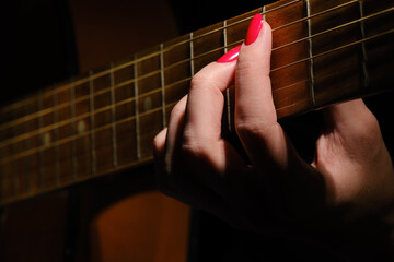 fingers on strings