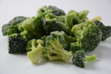 Small frozen  broccoli pieces.  Healthy food. Frozen vegetables