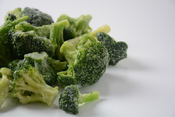 Small frozen  broccoli pieces.  Healthy food. Frozen vegetables