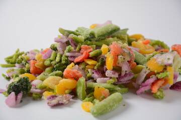Frozen vegetable mixture of carrots, broccoli ,peppers, red onion and peas. Healthy food