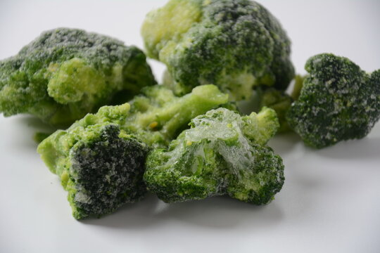 Small frozen  broccoli pieces.  Healthy food. Frozen vegetables