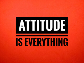 Selective focus.Word ATTITUDE IS EVERYTHING on red background.Motivation concept.