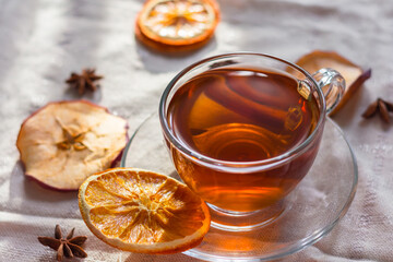 Cup of tea and slices of dried orange