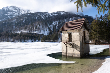 panorama of the frozen Lago del Predil in winter. Italian Alps in Friuli