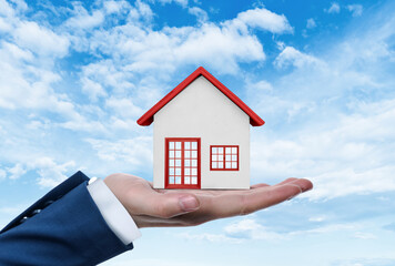 hand holding home, home loan concept