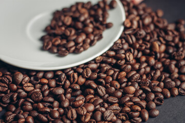 cup of coffee with brown beans on a gray background close-ups macro photography