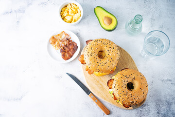 Fried bacon avocado cheese egg salad  bagel