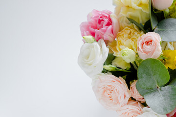 Female hands florist making a bouquet. Step by step instraction. Top horizontal view copyspace abstract pink background
