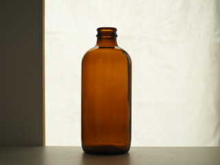 Brown glass bottle on a light background