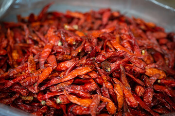 organic dried red spicy chillies. Red dried chillies are sold in markets in Bangkok.