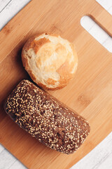 loaf of bread on a wooden board powerful products food