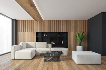 White sofa in wooden and black living room with plant and shelf in wall