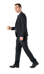 Businessman with coffee walking, isolated over white background