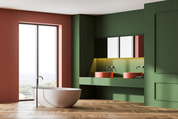 Fototapeta na wymiar Green and peach bathroom with white bathtub and sinks near window on parquet