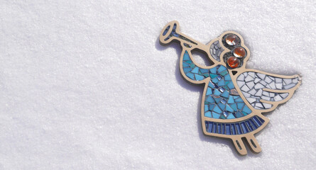 Nature macro photo mosaic angel on white snow. Beautiful Décor.  