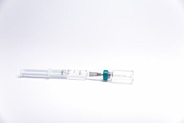 Obraz premium syringe with medication. distribution of the covid virus vaccine worldwide