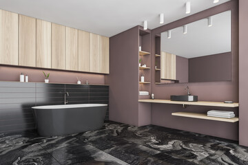 Black and pink bathroom with sink and bathtub on tiled marble floor