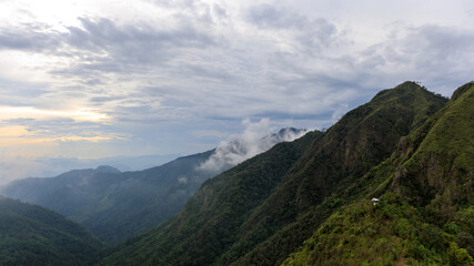 Obraz premium Panorama or panoramic photo landscape of camping tent on hill or mountain in the forest of Thailand, Asia.