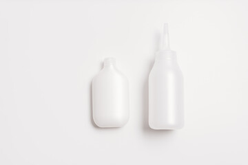 a tube with paint and a bottle with a convenient applicator for the developing emulsion for self-dyeing hair at home on a white background. saving time and money. home beauty salon.