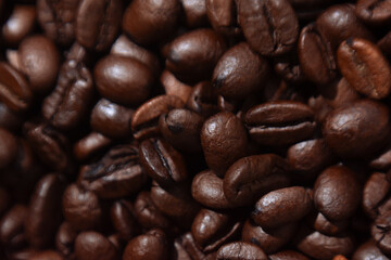 coffee beans lie on the background arabica