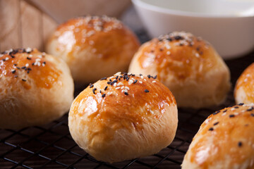 Fresh homemade whole grain burger buns with sesame