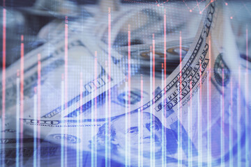 Double exposure of forex graph drawing over us dollars bill background. Concept of financial markets.