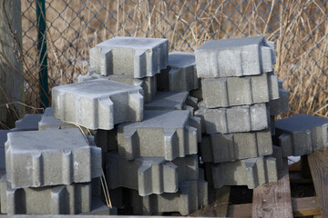 Pavement-Stacks of new concrete paving slabs on wooden pallets