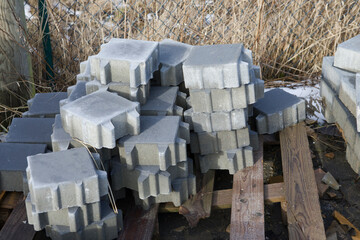 Pavement-Stacks of new concrete paving slabs on wooden pallets
