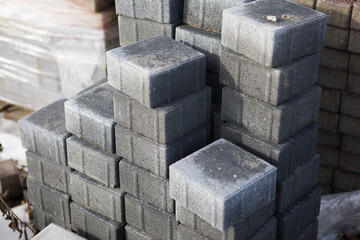 Pavement-Stacks of new concrete paving slabs on wooden pallets