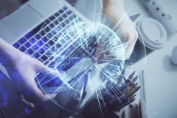 Multi exposure of woman hands typing on computer and business theme hologram drawing. Success concept.