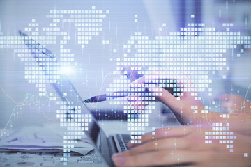 Multi exposure of woman hands typing on computer and business theme hologram drawing. Success concept.
