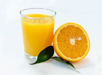 Glass of fresh orange juice on a white background.
