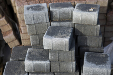 Pavement-Stacks of new concrete paving slabs on wooden pallets