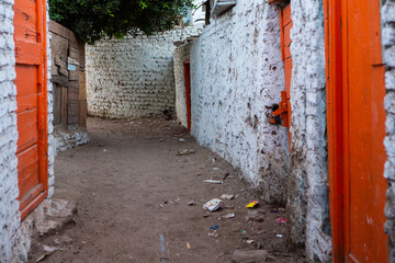 Colourful exterior wall of a Nubian house in Egypt. Typical African village houses facade. Medieval street.