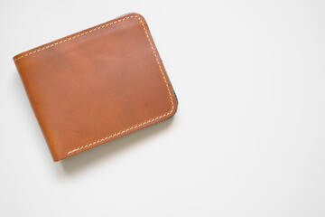 brown stitched wallet men or whiskey color and cow leather for put money and card on top view white table or background isolated with copyspace