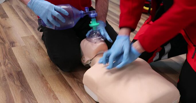 First aid training. Two medics train on courses. Reanimation with artificial ventilation . First Aid Cardiopulmonary Resuscitation, How to do the CPR