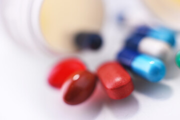 Composition with variety of drug pills and container