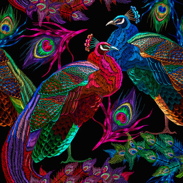 Embroidery peacocks, tropical birds seamless pattern. Fashionable template for design of clothes. Tails of peacocks art